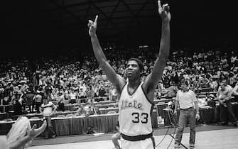 (Original Caption) Michigan State guard Earvin Johnson raises his hands and holds up one finger to denote that Michigan State is number ONE after they beat the Indiana State Sycamores 75-64 to win the NCAA championship at Utah University 3/26. Johnson was picked as the Most Valuable Player of the game.