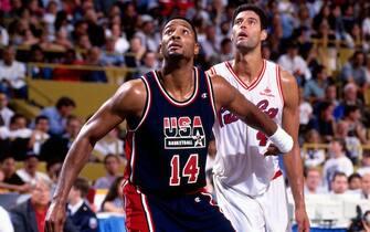 TORONTO - AUGUST 10: Alonzo Mourning #14 of the USA Senior Men's National Team boxes out against the Puerto Rican Senior Men's National Team during the 1994 World Championships of Basketball on August 10, 1994 at the Maple Leaf Gardens in Toronto, Ontario, Canada. The United States defeated Puerto Rico 134-83. NOTE TO USER: User expressly acknowledges and agrees that, by downloading and or using this photograph, User is consenting to the terms and conditions of the Getty Images License Agreement. Mandatory Copyright Notice: Copyright 1994 NBAE (Photo by Nathaniel S. Butler/NBAE via Getty Images)