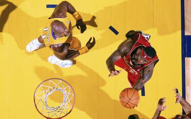 BALERSFIELD, CA - OCTOBER 19: LeBron James #23 of the Cleveland Cavaliers goes to the basket past Karl Malone #11 of the Los Angeles Lakers during the NBA preseason game at Centennial Gardens on October 19, 2003 in Bakersfield, California. The Cavaliers won 102-87. NOTE TO USER: User expressly acknowledges and agrees that, by downloading and/or using this Photograph, User is consenting to the terms and conditions of the Getty Images License Agreement. Copyright 2003 NBAE (Photo by Andrew D. Bernstein/NBAE via Getty Images)