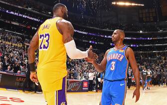 LOS ANGELES, CA - NOVEMBER 19: LeBron James #23 of the Los Angeles Lakers greets Chris Paul #3 of the Oklahoma City Thunder following the game on November 19, 2019 at STAPLES Center in Los Angeles, California. NOTE TO USER: User expressly acknowledges and agrees that, by downloading and/or using this Photograph, user is consenting to the terms and conditions of the Getty Images License Agreement. Mandatory Copyright Notice: Copyright 2019 NBAE (Photo by Andrew D. Bernstein/NBAE via Getty Images)