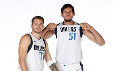 DALLAS, TX - SEPTEMBER 30: Luka Doncic #77 and Boban Marjanovic #51 of the Dallas Mavericks pose for a portrait during Media Day on September 30, 2019 at the American Airlines Center in Dallas, Texas. NOTE TO USER: User expressly acknowledges and agrees that, by downloading and or using this photograph, User is consenting to the terms and conditions of the Getty Images License Agreement. Mandatory Copyright Notice: Copyright 2019 NBAE (Photo by Glenn James/NBAE via Getty Images)