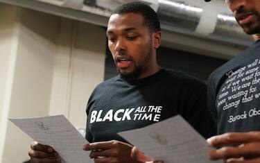 ORLANDO, FL - AUGUST 26: Sterling Brown and George Hill of the Milwaukee Bucks reads a statement to the media on August 26, 2020 at AdventHealth Arena at ESPN Wide World of Sports Complex in Orlando, Florida. NOTE TO USER: User expressly acknowledges and agrees that, by downloading and/or using this photograph, user is consenting to the terms and conditions of the Getty Images License Agreement.  Mandatory Copyright Notice: Copyright 2020 NBAE (Photo by Jesse D. Garrabrant/NBAE via Getty Images)
