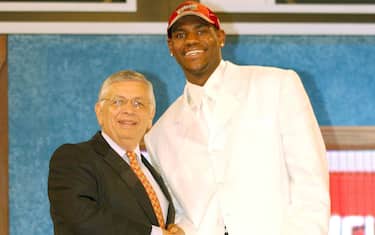 NEW YORK - JUNE 26:  LeBron James who was selected number one overall in the first round by the Cleveland Cavailiers shakes hands with NBA Commissioner David Stern during the 2003 NBA Draft at the Paramount Theatre at Madison Square Garden on June 26, 2003 in New York, New York.  NOTE TO USER: User expressly acknowledges and agrees that, by downloading and/or using this Photograph, User is consenting to the terms and conditions of the Getty Images License Agreement.  (Photo by Jesse D. Garrabrant/NBAE via Getty Images)
