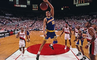 PORTLAND, OR - CIRCA 1993: Chris Gatling #25 of the Golden State Warriors dunks against the Portland Trailblazers at the Veterans Memorial Coliseum circa 1993 in Portland, Oregon. NOTE TO USER: User expressly acknowledges and agrees that, by downloading and or using this photograph, User is consenting to the terms and conditions of the Getty Images License Agreement. Mandatory Copyright Notice: Copyright 1993 NBAE (Photo by Brian Drake/NBAE via Getty Images)