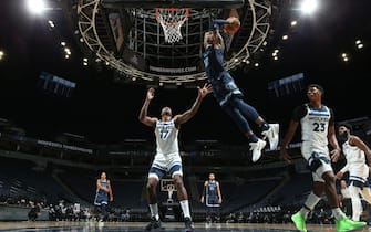 MINNEAPOLIS, MN -  DECEMBER 12: Ja Morant #12 of the Memphis Grizzlies drives to the basket against the Minnesota Timberwolves during a preseason game on December 12, 2020 at Target Center in Minneapolis, Minnesota. NOTE TO USER: User expressly acknowledges and agrees that, by downloading and or using this Photograph, user is consenting to the terms and conditions of the Getty Images License Agreement. Mandatory Copyright Notice: Copyright 2020 NBAE (Photo by David Sherman/NBAE via Getty Images)