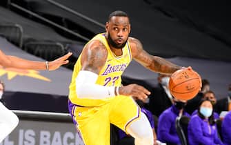 PHOENIX, AZ - DECEMBER 16: LeBron James #23 of the Los Angeles Lakers drives in the game against the Phoenix Suns on December 16, 2020 at the Talking Stick Resort Arena in Phoenix, Arizona. NOTE TO USER: User expressly acknowledges and agrees that, by downloading and or using this Photograph, user is consenting to the terms and conditions of the Getty Images License Agreement. Mandatory Copyright Notice: Copyright 2020 NBAE (Photo by Barry Gossage/NBAE via Getty Images)