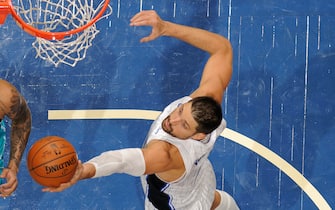 ORLANDO, FL - DECEMBER 17: Nikola Vucevic #9 of the Orlando Magic grabs a rebound against the Charlotte Hornets during a preseason game on December 17, 2020 at Amway Center in Orlando, Florida. NOTE TO USER: User expressly acknowledges and agrees that, by downloading and/or using this Photograph, user is consenting to the terms and conditions of the Getty Images License Agreement. Mandatory Copyright Notice: Copyright 2020 NBAE (Photo by Fernando Medina/NBAE via Getty Images)