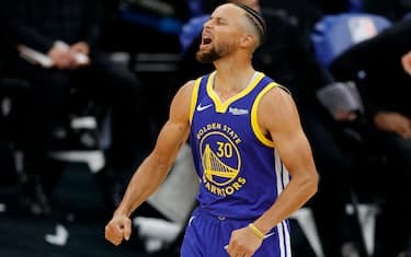 SACRAMENTO, CALIFORNIA - DECEMBER 17:  Stephen Curry #30 of the Golden State Warriors reacts after the Warriors made a basket against the Sacramento Kings at Golden 1 Center on December 17, 2020 in Sacramento, California. NOTE TO USER: User expressly acknowledges and agrees that, by downloading and or using this photograph, User is consenting to the terms and conditions of the Getty Images License Agreement.  (Photo by Ezra Shaw/Getty Images)