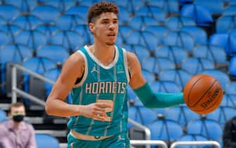 1230186950 ORLANDO, FL - DECEMBER 17: LaMelo Ball #2 of the Charlotte Hornets dribbles the ball up court against the Orlando Magic during a preseason game on December 17, 2020 at Amway Center in Orlando, Florida. NOTE TO USER: User expressly acknowledges and agrees that, by downloading and/or using this Photograph, user is consenting to the terms and conditions of the Getty Images License Agreement. Mandatory Copyright Notice: Copyright 2020 NBAE (Photo by Fernando Medina/NBAE via Getty Images)