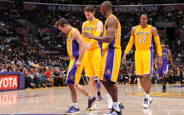 LOS ANGELES, CA - OCTOBER 21:  (L-R) Steve Nash #10, Pau Gasol #16, Kobe Bryant #24, and Dwight Howard #12 of the Los Angeles Lakers walk toward the bench against the Sacramento Kings during a pre-season game at Staples Center on October 21, 2012 in Los Angeles, California. NOTE TO USER: User expressly acknowledges and agrees that, by downloading and/or using this Photograph, user is consenting to the terms and conditions of the Getty Images License Agreement. Mandatory Copyright Notice: Copyright 2012 NBAE (Photo by Andrew D. Bernstein/NBAE via Getty Images)