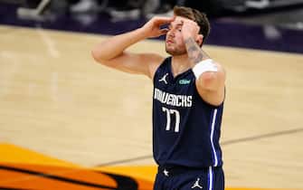 PHOENIX, ARIZONA - DECEMBER 23: Luka Doncic #77 of the Dallas Mavericks reacts to a foul call during the second half of the NBA game against the Phoenix Suns at PHX Arena on December 23, 2020 in Phoenix, Arizona.  NOTE TO USER: User expressly acknowledges and agrees that, by downloading and/or using this Photograph, user is consenting to the terms and conditions of the Getty Images License Agreement. Mandatory Copyright Notice: Copyright 2020 NBAE (Photo by Christian Petersen/Getty Images)