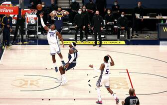 DENVER, CO - DECEMBER 23: Buddy Hield #24 of the Sacramento Kings tips in the game-winning shot against the Denver Nuggets at Ball Arena on December 23, 2020 in Denver, Colorado. NOTE TO USER: User expressly acknowledges and agrees that, by downloading and/or using this photograph, user is consenting to the terms and conditions of the Getty Images License Agreement (Photo by Jamie Schwaberow/Getty Images)