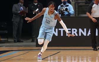 MEMPHIS, TN - DECEMBER 23: Ja Morant #12 of the Memphis Grizzlies celebrates during the game against the San Antonio Spurs on December 23, 2020 at FedExForum in Memphis, Tennessee. NOTE TO USER: User expressly acknowledges and agrees that, by downloading and or using this photograph, User is consenting to the terms and conditions of the Getty Images License Agreement. Mandatory Copyright Notice: Copyright 2020 NBAE (Photo by Joe Murphy/NBAE via Getty Images)