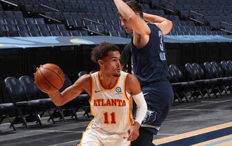 MEMPHIS, TN - DECEMBER 26: Trae Young #11 of the Atlanta Hawks handles the ball during the game against the Memphis Grizzlies on December 26, 2020 at FedExForum in Memphis, Tennessee. NOTE TO USER: User expressly acknowledges and agrees that, by downloading and or using this photograph, User is consenting to the terms and conditions of the Getty Images License Agreement. Mandatory Copyright Notice: Copyright 2020 NBAE (Photo by Joe Murphy/NBAE via Getty Images)