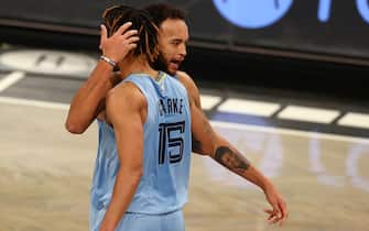 NEW YORK, NEW YORK - DECEMBER 28: Kyle Anderson #1 and Brandon Clarke #15 of the Memphis Grizzlies celebrates after defeating the Brooklyn Nets 116-111 in OT at Barclays Center on December 28, 2020 in New York City. (Photo by Mike Stobe/Getty Images)