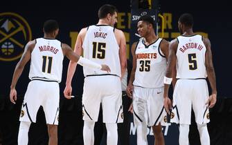 DENVER, CO - DECEMBER 28: Monte Morris #11, Nikola Jokic #15, PJ Dozier #35, and Will Barton #5 of the Denver Nuggets talk during the game against the Houston Rockets on December 28, 2020 at the Pepsi Center in Denver, Colorado. NOTE TO USER: User expressly acknowledges and agrees that, by downloading and/or using this Photograph, user is consenting to the terms and conditions of the Getty Images License Agreement. Mandatory Copyright Notice: Copyright 2020 NBAE (Photo by Garrett Ellwood/NBAE via Getty Images)