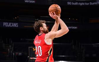 PHOENIX, AZ - DECEMBER 29: Nicolo Melli #20 of the New Orleans Pelicans shoots a 3-pointer against the Phoenix Suns on December 29, 2020 at Talking Stick Resort Arena in Phoenix, Arizona. NOTE TO USER: User expressly acknowledges and agrees that, by downloading and or using this photograph, user is consenting to the terms and conditions of the Getty Images License Agreement. Mandatory Copyright Notice: Copyright 2020 NBAE (Photo by Michael Gonzales/NBAE via Getty Images)
