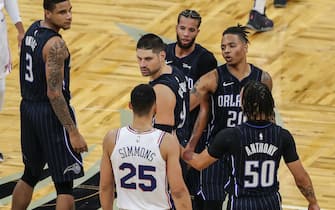 ORLANDO, FL - DECEMBER 31:  Ben Simmons #25 of the Philadelphia 76ers exchanges words with Nikola Vucevic #9 of the Orlando Magic as Chuma Okeke #3, Cole Anthony #50 and Markelle Fultz #20 of the Magic look on at Amway Center on December 31, 2020 in Orlando, Florida. NOTE TO USER: User expressly acknowledges and agrees that, by downloading and or using this photograph, User is consenting to the terms and conditions of the Getty Images License Agreement. (Photo by Alex Menendez/Getty Images)