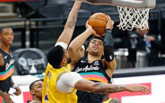 1230384620 SAN ANTONIO, TX - JANUARY 1: Keldon Johnson #3 of the San Antonio Spurs #3 shoots over Anthony Davis #3 of the Los Angeles Lakers during first half action at AT&T Center on January 1 , 2021 in San Antonio, Texas. NOTE TO USER: User expressly acknowledges and agrees that , by downloading and or using this photograph, User is consenting to the terms and conditions of the Getty Images License Agreement. (Photo by Ronald Cortes/Getty Images)