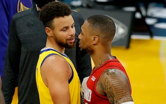 SAN FRANCISCO, CALIFORNIA - JANUARY 03:  Stephen Curry #30 of the Golden State Warriors is congratulated by Damian Lillard #0 of the Portland Trail Blazers after Curry scored a career-high 62 points against the Portland Trail Blazers at Chase Center on January 03, 2021 in San Francisco, California. NOTE TO USER: User expressly acknowledges and agrees that, by downloading and or using this photograph, User is consenting to the terms and conditions of the Getty Images License Agreement.  (Photo by Ezra Shaw/undefined)