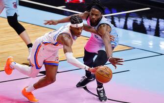 MIAMI, FLORIDA - JANUARY 04: Shai Gilgeous-Alexander #2 of the Oklahoma City Thunder and Precious Achiuwa #5 of the Miami Heat battle for a loose ball during the third quarter at American Airlines Arena on January 04, 2021 in Miami, Florida. NOTE TO USER: User expressly acknowledges and agrees that, by downloading and or using this photograph, User is consenting to the terms and conditions of the Getty Images License Agreement. (Photo by Michael Reaves/Getty Images)