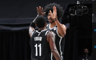 BROOKLYN, NY - JANUARY 5: Kyrie Irving #11 and Jarrett Allen #31 of the Brooklyn Nets hi-five during the game against the Utah Jazz on January 5, 2021 at Barclays Center in Brooklyn, New York. NOTE TO USER: User expressly acknowledges and agrees that, by downloading and or using this Photograph, user is consenting to the terms and conditions of the Getty Images License Agreement. Mandatory Copyright Notice: Copyright 2021 NBAE (Photo by Nathaniel S. Butler/NBAE via Getty Images)
