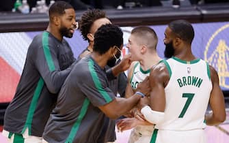 MIAMI, FLORIDA - JANUARY 06: Payton Pritchard #11 of the Boston Celtics celebrates with his teammates after making a game-winning layup with 0.2 seconds remaining against the Miami Heat during the fourth quarter at American Airlines Arena on January 06, 2021 in Miami, Florida. NOTE TO USER: User expressly acknowledges and agrees that, by downloading and or using this photograph, User is consenting to the terms and conditions of the Getty Images License Agreement. (Photo by Michael Reaves/Getty Images)