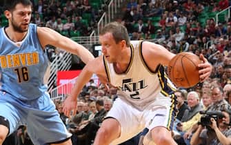 SALT LAKE CITY, UT - DECEMBER 18:  Joe Ingles #2 of the Utah Jazz handles the ball against Kostas Papanikolaou #16 of the Denver Nuggets on December 18, 2015 at Vivint Smart Home Arena in Salt Lake City, Utah. NOTE TO USER: User expressly acknowledges and agrees that, by downloading and or using this Photograph, User is consenting to the terms and conditions of the Getty Images License Agreement. Mandatory Copyright Notice: Copyright 2015 NBAE (Photo by Melissa Majchrzak/NBAE via Getty Images)