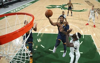 MILWAUKEE, WI - JANUARY 8: Donovan Mitchell #45 of the Utah Jazz shoots the ball against the Milwaukee Bucks on January 8, 2021 at the Fiserv Forum Center in Milwaukee, Wisconsin. NOTE TO USER: User expressly acknowledges and agrees that, by downloading and or using this Photograph, user is consenting to the terms and conditions of the Getty Images License Agreement. Mandatory Copyright Notice: Copyright 2021 NBAE (Photo by Gary Dineen/NBAE via Getty Images).