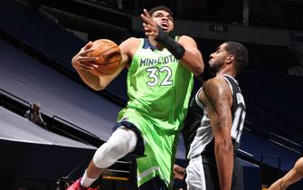 MINNEAPOLIS, MN -  JANUARY 9: Karl-Anthony Towns #32 of the Minnesota Timberwolves shoots the ball during the game against the San Antonio Spurs on January 9, 2021 at Target Center in Minneapolis, Minnesota. NOTE TO USER: User expressly acknowledges and agrees that, by downloading and or using this Photograph, user is consenting to the terms and conditions of the Getty Images License Agreement. Mandatory Copyright Notice: Copyright 2021 NBAE (Photo by David Sherman/NBAE via Getty Images)