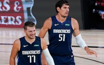 LAKE BUENA VISTA, FLORIDA - AUGUST 02: Luka Doncic #77 and Boban Marjanovic #51 of the Dallas Mavericks move back on defense against the Phoenix Suns during the first half at Visa Athletic Center at ESPN Wide World Of Sports Complex on August 2, 2020 in Lake Buena Vista, Florida. NOTE TO USER: User expressly acknowledges and agrees that, by downloading and or using this photograph, User is consenting to the terms and conditions of the Getty Images License Agreement. (Photo by Ashley Landis-Pool/Getty Images)