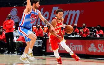 ATLANTA, GA - JANUARY 27: Trae Young #11 of the Atlanta Hawks dribbles during the game against the Brooklyn Nets on January 27, 2021 at State Farm Arena in Atlanta, Georgia. NOTE TO USER: User expressly acknowledges and agrees that, by downloading and/or using this Photograph, user is consenting to the terms and conditions of the Getty Images License Agreement. Mandatory Copyright Notice: Copyright 2021 NBAE (Photo by Scott Cunningham/NBAE via Getty Images)