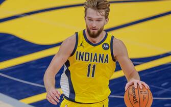 INDIANAPOLIS, IN - DECEMBER 23: Domantas Sabonis #11 of the Indiana Pacers brings the ball up court during the game New York Knicks at Bankers Life Fieldhouse on December 23, 2020 in Indianapolis, Indiana. (Photo by Michael Hickey/Getty Images)