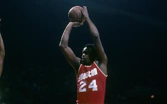 BALTIMORE, MD - CIRCA 1980's: Moses Malone #24 of the Houston Rockets shoots a jump shot over Rick Mahorn #44 of the Washington Bullets during a early circa 1980's NBA basketball game at the Baltimore Coliseum in Baltimore, Maryland. Malone played for the Rockets from 1976-82. (Photo by Focus on Sport/Getty Images)