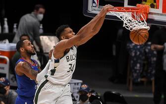 DENVER, CO - FEBRUARY 8: Giannis Antetokounmpo (34) of the Milwaukee Bucks dunks as Monte Morris (11) of the Denver Nuggets, Paul Millsap (4) and Michael Porter Jr. (1) watch during the fourth quarter of Milwaukee's 125-112 win at Ball Arena on Monday, February 8, 2021. (Photo by AAron Ontiveroz/MediaNews Group/The Denver Post via Getty Images)