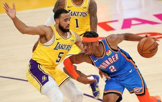 LOS ANGELES, CALIFORNIA - FEBRUARY 08: Shai Gilgeous-Alexander #2 of the Oklahoma City Thunder drives against Talen Horton-Tucker #5 of the Los Angeles Lakers at Staples Center on February 08, 2021 in Los Angeles, California. NOTE TO USER: User expressly acknowledges and agrees that, by downloading and or using this photograph, User is consenting to the terms and conditions of the Getty Images License Agreement. (Photo by Meg Oliphant/Getty Images)