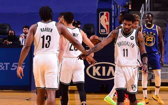 SAN FRANCISCO, CA - FEBRUARY 13: Kyrie Irving #11 of the Brooklyn Nets high-fives teammate James Harden #13 during the game against the Golden State Warriors on February 13, 2021 at Chase Center in San Francisco, California. NOTE TO USER: User expressly acknowledges and agrees that, by downloading and or using this photograph, user is consenting to the terms and conditions of Getty Images License Agreement. Mandatory Copyright Notice: Copyright 2021 NBAE (Photo by Noah Graham/NBAE via Getty Images)