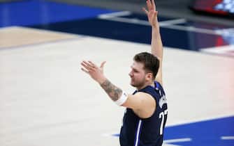 DALLAS, TEXAS - FEBRUARY 23: Luka Doncic #77 of the Dallas Mavericks celebrates after making the game-winning shot against the Boston Celtics at American Airlines Center on February 23, 2021 in Dallas, Texas. NOTE TO USER: User expressly acknowledges and agrees that, by downloading and or using this photograph, User is consenting to the terms and conditions of the Getty Images License Agreement. (Photo by Tom Pennington/Getty Images)