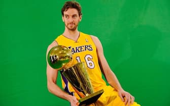 EL SEGUNDO, CA - SEPTEMBER 25: Pau Gasol #16 of the Los Angeles Lakers poses for a photograph with the NBA Finals Larry O'Brien Championship Trophy during Media Day at the Toyota Center on September 25, 2010 in El Segundo, California. NOTE TO USER: User expressly acknowledges and agrees that, by downloading and/or using this Photograph, user is consenting to the terms and conditions of the Getty Images License Agreement. (Photo by Kevork Djansezian/Getty Images)