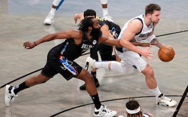 NEW YORK, NEW YORK - FEBRUARY 27: Luka Doncic #77 of the Dallas Mavericks dribbles as James Harden #13 of the Brooklyn Nets defends during the first half at Barclays Center on February 27, 2021 in the Brooklyn borough of New York City. NOTE TO USER: User expressly acknowledges and agrees that, by downloading and or using this Photograph, user is consenting to the terms and conditions of the Getty Images License Agreement. (Photo by Sarah Stier/Getty Images)