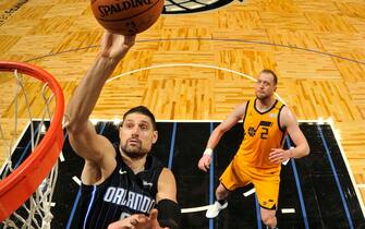 ORLANDO, FL - FEBRUARY 27: Nikola Vucevic #9 of the Orlando Magic shoots the ball during the game against the Utah Jazz on February 27, 2021 at Amway Center in Orlando, Florida. NOTE TO USER: User expressly acknowledges and agrees that, by downloading and or using this photograph, User is consenting to the terms and conditions of the Getty Images License Agreement. Mandatory Copyright Notice: Copyright 2021 NBAE (Photo by Fernando Medina/NBAE via Getty Images)