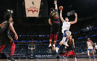 1231678160 NEW ORLEANS, LA -MARCH 12: Nicolo Melli #20 of the New Orleans Pelicans shoots the ball during the game against the Cleveland Cavaliers on March 12, 2021 at the Smoothie King Center in New Orleans, Louisiana. NOTE TO USER: User expressly acknowledges and agrees that, by downloading and or using this Photograph, user is consenting to the terms and conditions of the Getty Images License Agreement. Mandatory Copyright Notice: Copyright 2021 NBAE (Photo by Layne Murdoch Jr./NBAE via Getty Images)