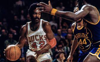 MILWAUKEE - 1971:  Lucius Allen #42 of the Milwaukee Bucks handles the ball against the Golden State Warriors during a game circa 1971  at the MECCA Arena in Milwaukee, Wisconsin. NOTE TO USER: User expressly acknowledges that, by downloading and or using this photograph, User is consenting to the terms and conditions of the Getty Images License agreement. Mandatory Copyright Notice: Copyright 1971 NBAE (Photo by Vernon Biever/NBAE via Getty Images)