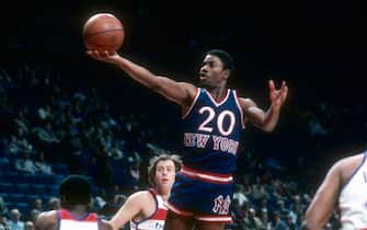 LANDOVER, MD - CIRCA 1980: Michael Ray Richardson #20 of the New York Knicks shoots over Kevin Porter #1 of the Washington Bullets during an NBA basketball game circa 1980 at the Capital Centre in Landover, Maryland. Richardson played for the Knicks from 1978-82. (Photo by Focus on Sport/Getty Images) *** Local Caption *** Michael Ray Richardson; Kevin Porter