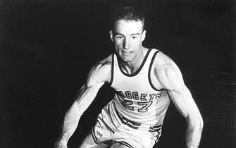 FILE - In this 1950 file photo, the Denver Nuggets' Kenny Sailors dribbles a basketball.  Sailors, a College basketball Hall of Famer and the man credited by some with being the first to use the modern jump shot, died in his sleep early Saturday, Jan. 30, 2016, at an assisted living center in Laramie, Wyo., the University of Wyoming announced. He was 95.  (AP Photo/File)