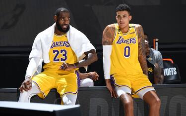 ORLANDO, FL - AUGUST 29: LeBron James #23 and Kyle Kuzma #0 of the Los Angeles Lakers watches the game from the sidelines during Round One, Game Five of the NBA Playoffs on August 29, 2020 at AdventHealth Arena in Orlando, Florida. NOTE TO USER: User expressly acknowledges and agrees that, by downloading and/or using this Photograph, user is consenting to the terms and conditions of the Getty Images License Agreement. Mandatory Copyright Notice: Copyright 2020 NBAE (Photo by Andrew D. Bernstein/NBAE via Getty Images)
