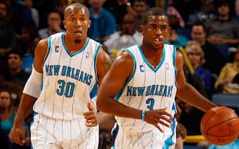 NEW ORLEANS - NOVEMBER 13:  David West #30 and Chris Paul #3 of the New Orleans Hornets is carried off the court after falling against the Portland Trail Blazers at the New Orleans Arena on November 13, 2009 in New Orleans, Louisiana.  NOTE TO USER: User expressly acknowledges and agrees that, by downloading and/or using this Photograph, User is consenting to the terms and conditions of the Getty Images License Agreement.  (Photo by Chris Graythen/Getty Images)