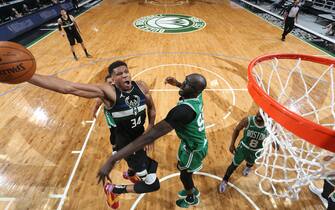 MILWAUKEE, WI - MARCH 26: Giannis Antetokounmpo #34 of the Milwaukee Bucks drives to the basket against the Boston Celtics on March 26 2021 at the Fiserv Forum Center in Milwaukee, Wisconsin. NOTE TO USER: User expressly acknowledges and agrees that, by downloading and or using this Photograph, user is consenting to the terms and conditions of the Getty Images License Agreement. Mandatory Copyright Notice: Copyright 2021 NBAE (Photo by Gary Dineen/NBAE via Getty Images).