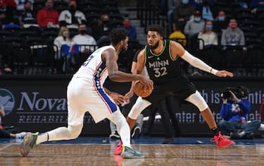 PHILADELPHIA, PA - APRIL 3: Karl-Anthony Towns #32 of the Minnesota Timberwolves plays defense against Joel Embiid #21 of the Philadelphia 76ers on April 3, 2021 at Wells Fargo Center in Philadelphia, Pennsylvania. NOTE TO USER: User expressly acknowledges and agrees that, by downloading and/or using this Photograph, user is consenting to the terms and conditions of the Getty Images License Agreement. Mandatory Copyright Notice: Copyright 2021 NBAE (Photo by David Dow/NBAE via Getty Images) 