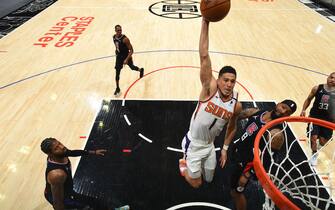 LOS ANGELES, CA - APRIL 8: Devin Booker #1 of the Phoenix Suns drives to the basket during the game against the LA Clippers on April 8, 2021 at STAPLES Center in Los Angeles, California. NOTE TO USER: User expressly acknowledges and agrees that, by downloading and/or using this Photograph, user is consenting to the terms and conditions of the Getty Images License Agreement. Mandatory Copyright Notice: Copyright 2021 NBAE (Photo by Adam Pantozzi/NBAE via Getty Images)